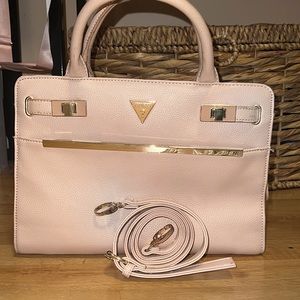 Medium size light pink GUESS purse.